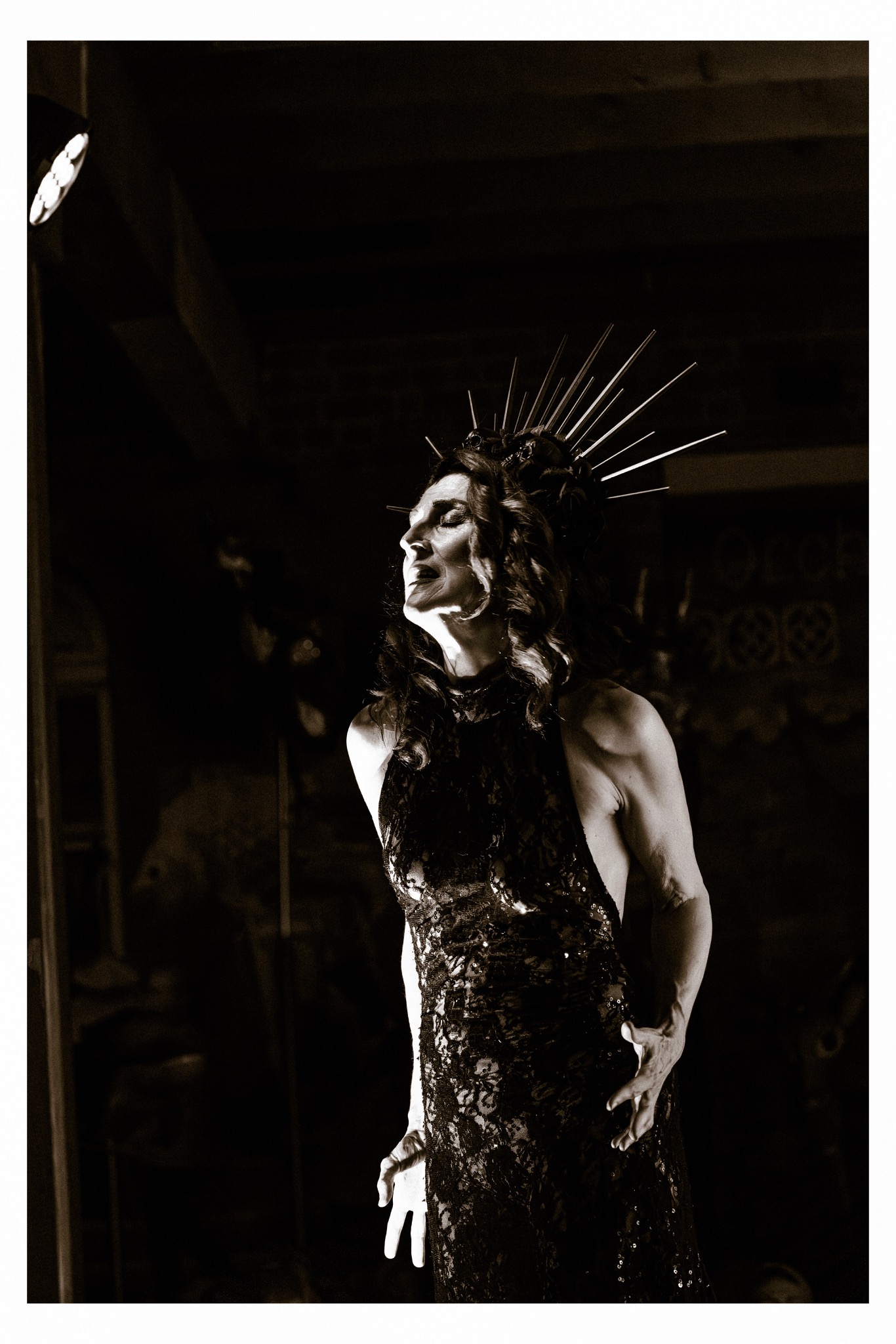 A performer on a dark stage